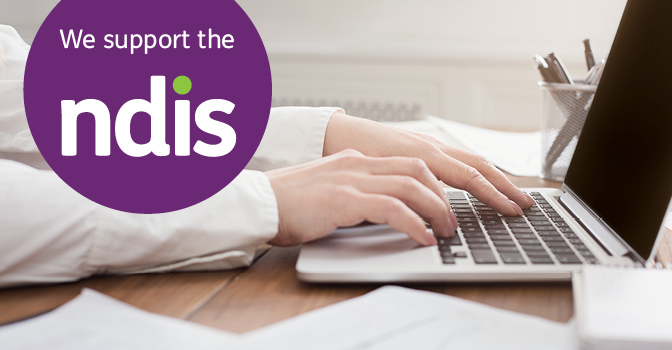 we support the NDIS sticker over a picture of someone typing on a laptop