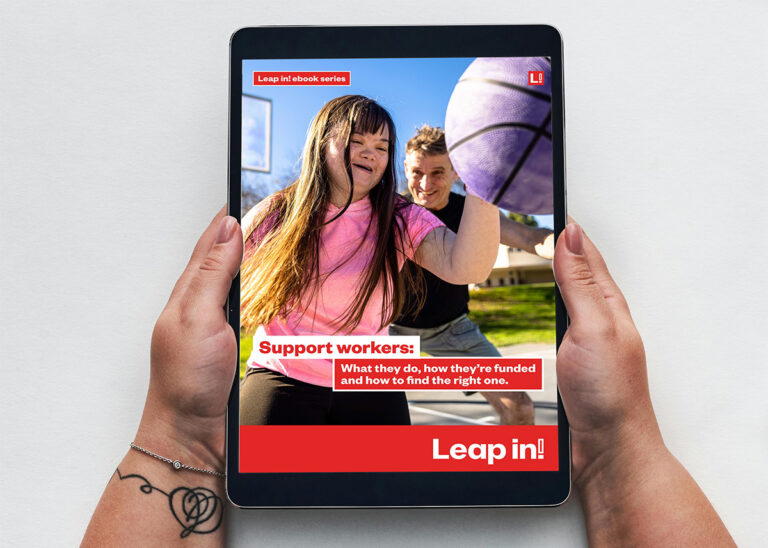 Person holding an ipad with the Leap in! Support workers ebook displayed on the screen