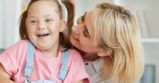 Little girl and mum smiling