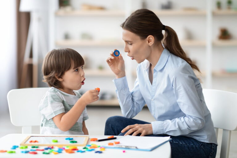 A speech therapist working with a child