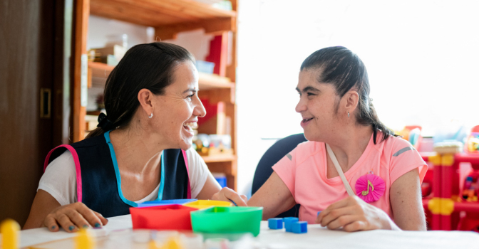 A young woman with her support worker
