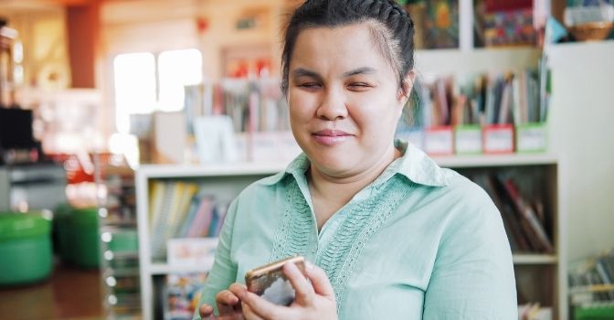 Young woman reading Braille