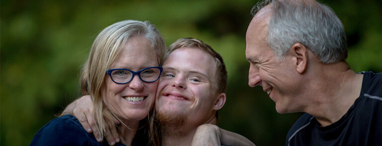 Three people together laughing