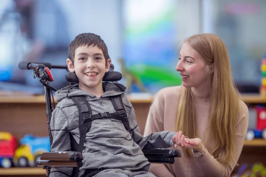 Boy in custom wheelchair with his mother