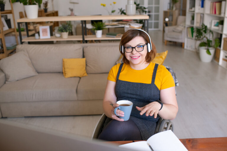 Young woman at home with headphones on