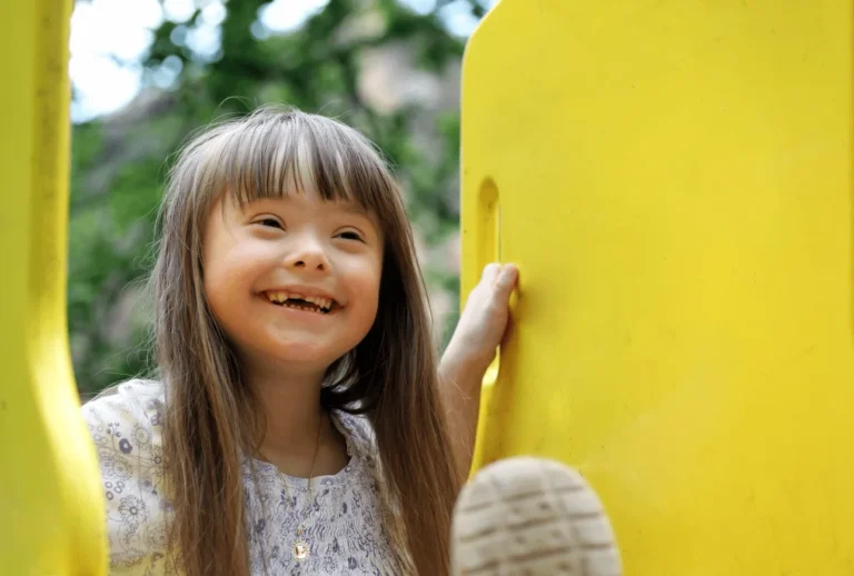 A young girl playing at the playground