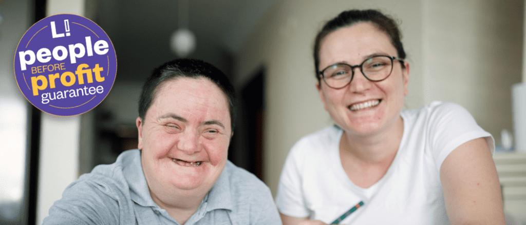 A woman and her support worker, both smiling