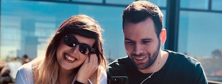 young people sharing earphones