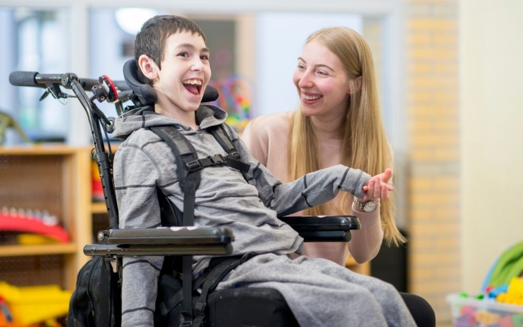 leapin-web-image-1024×640-young-boy-wheelchair-woman