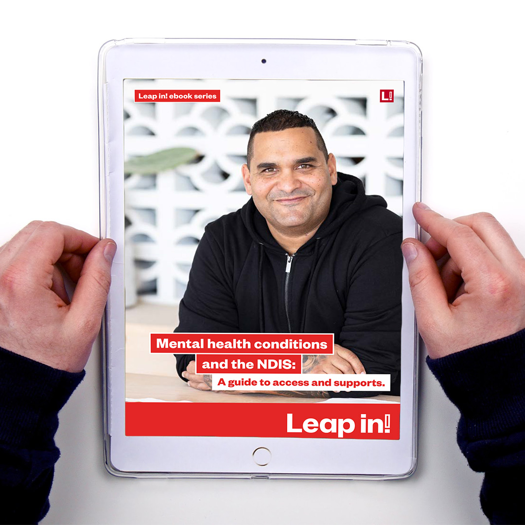 Person holding ipad with the Leap in! Mental health conditions and the NDIS ebook