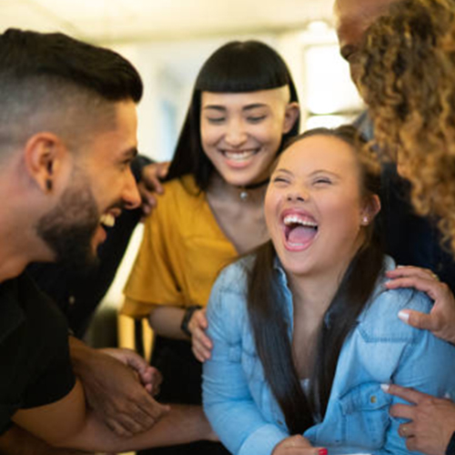 Group of young co-workers laughing