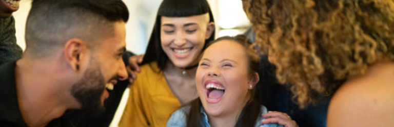 Group of young co-workers laughing