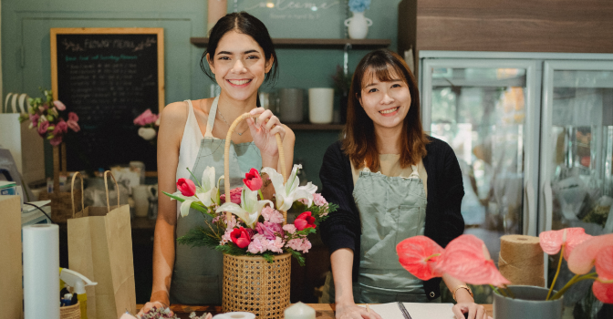 Two women working in a flower store