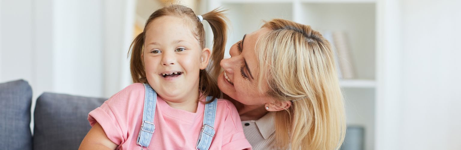 woman behind young girl both laughing