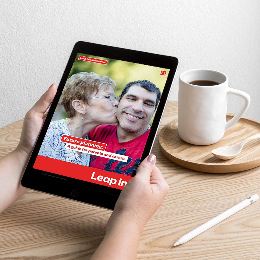Woman holding ipad with the Future Planning ebook showing.